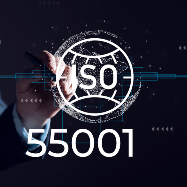 A consultant pointing to a digital display about working with an expert ISO 55001 consultant.